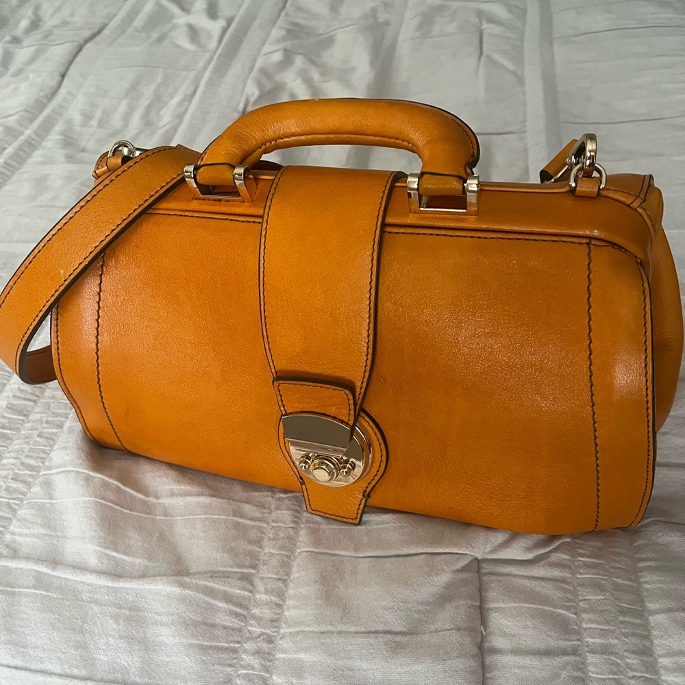 Orange Leather Satchel with Structured Design and Top Handles